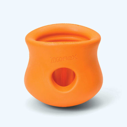 Orange durable rubber customizable puzzle and treat toy with a hole on the side and flexible construction for dogs