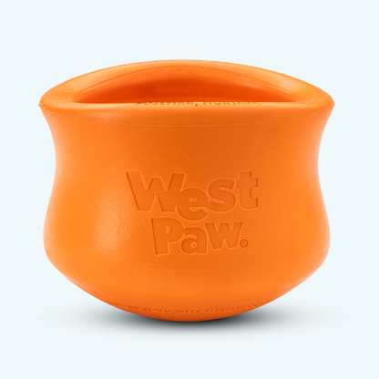 Orange durable rubber customizable puzzle and treat toy for dogs with embossed West Paw logo and wide opening