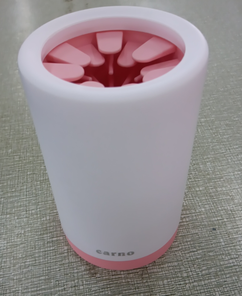 Portable pink and white silicone bristle paw cleaner for pets