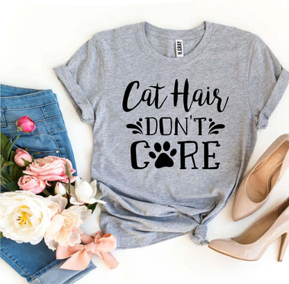 Gray Cat Hair Don't Care T-Shirt with paw print, paired with blue jeans and beige heels
