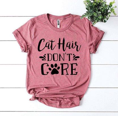 Pink Cat Hair Don't Care T-Shirt with black text and paw print design on soft cotton fabric
