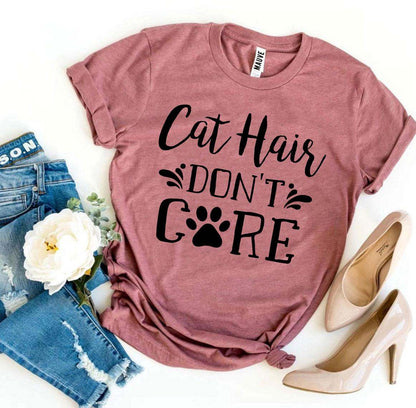 Cat Hair Don't Care T-Shirt in mauve with black text and paw print, paired with ripped blue jeans and beige heels
