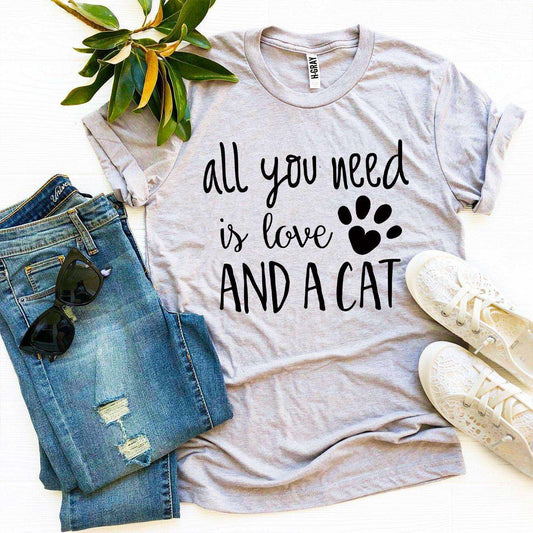 Gray Love And a Cat T-Shirt with paw print, paired with blue jeans and white sneakers on white background
