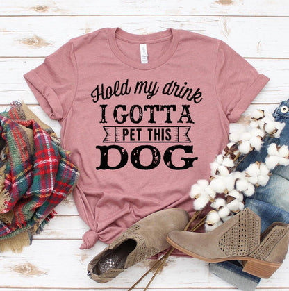 Hold My Drink I Gotta Pet This Dog T-shirt made of premium ring spun cotton with soft textile flex print