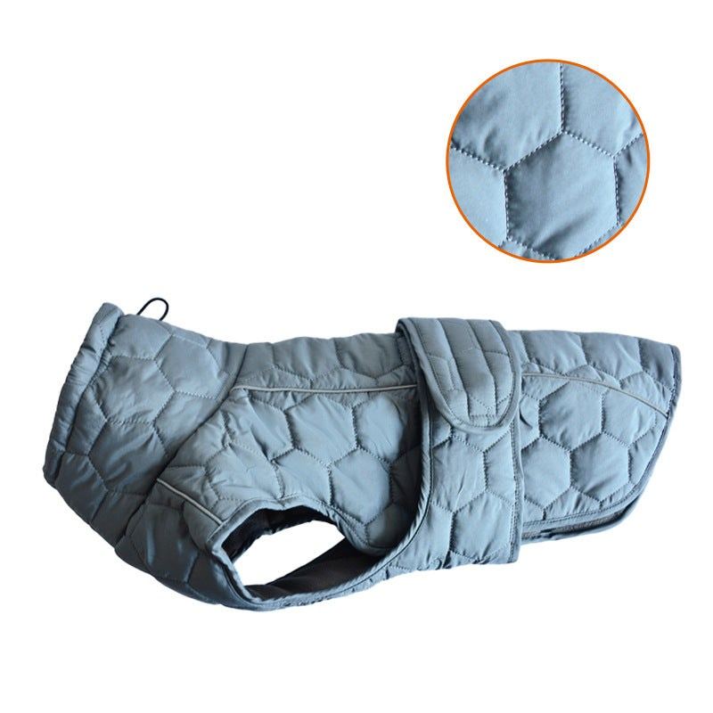 Dog clothing outdoor vest in slate blue quilted fabric, with a padded stand collar and wide Velcro closure.