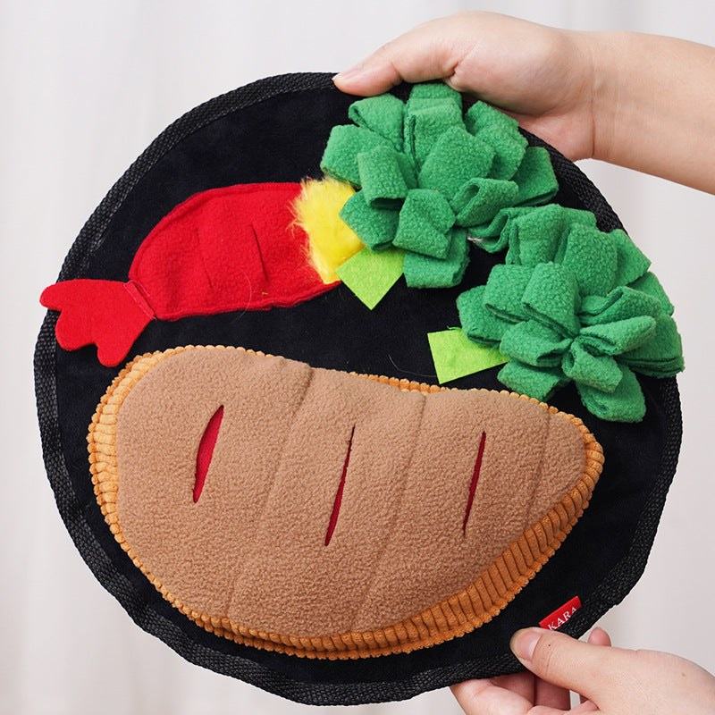 Dog sniffing mat made of soft polar fleece with colorful green, red, yellow, and brown sections shaped like food items for scent play