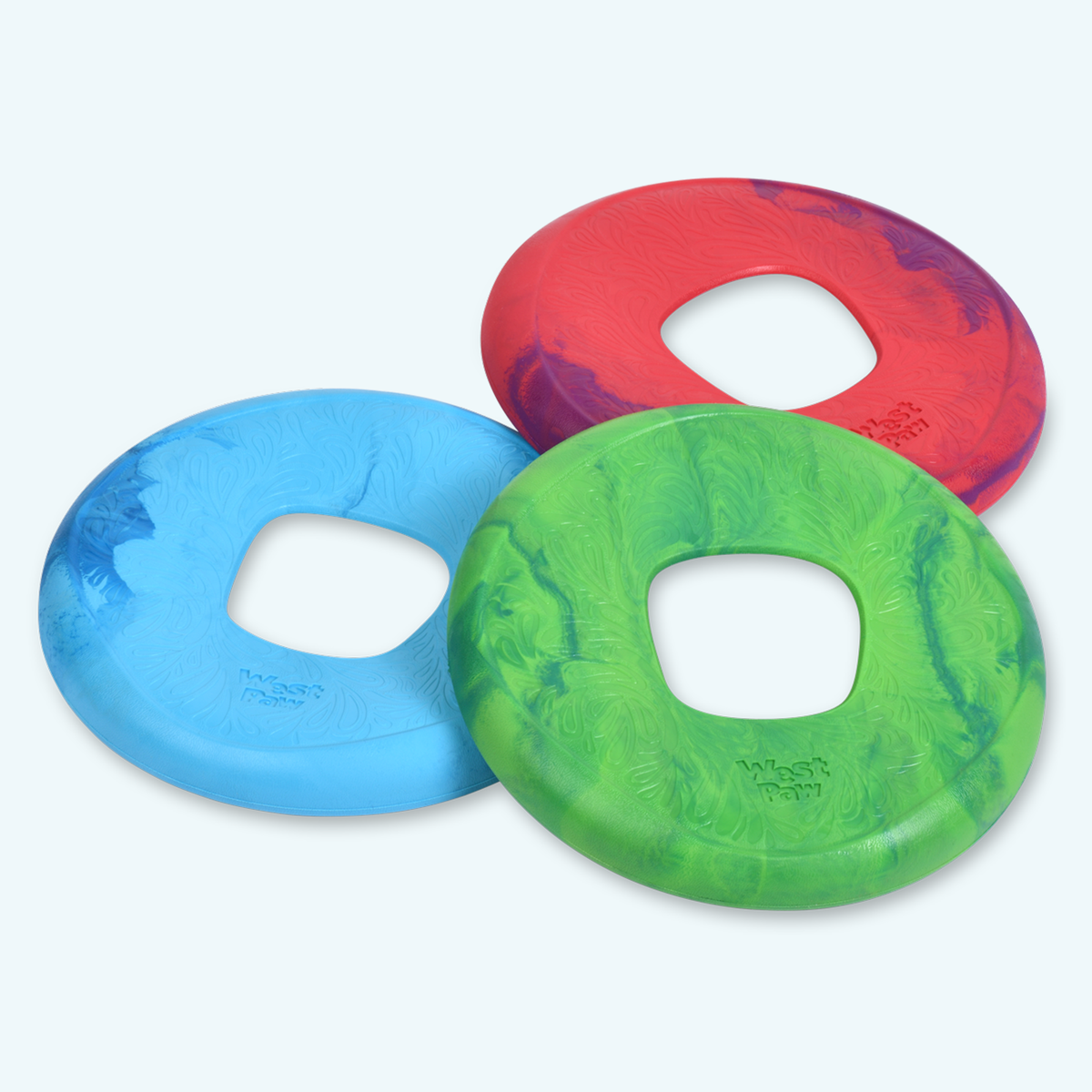 Three dogs favorite high-flying disc in red, blue, and green with a marbled pattern and a central hole for easy grip