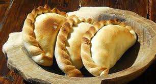 Organic beef EmPAWnadas dog treats with soft whole-wheat pastry and cheddar cheese, handmade and baked fresh.