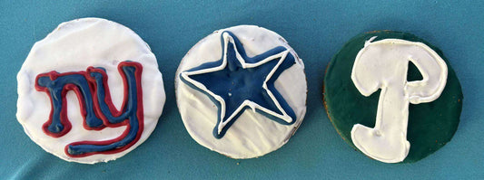 Football Sports Team Cookies featuring white, blue, green, and red icing with New York Giants, Dallas Cowboys, and Philadelphia Eagles logos
