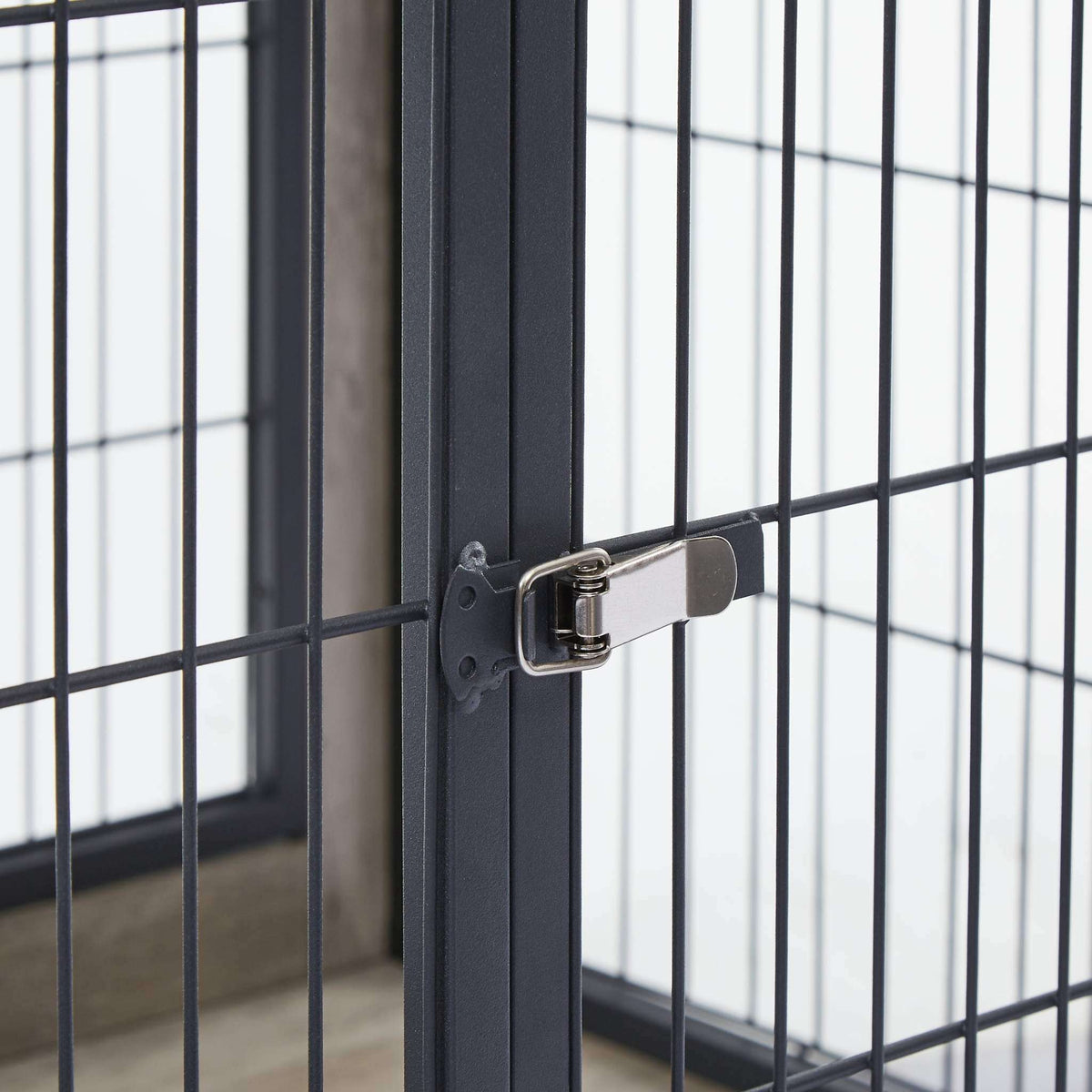 Furniture Dog Crate with Double Doors showing a close-up of dark grey steel bars and a silver metal latch