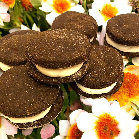 PAWoreo Organic dog treats resembling Oreo cookies with carob and wholesome ingredients on floral background