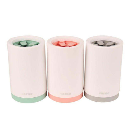 Paw Cleaner devices in three pastel colors with white silicone body and soft bristles for gentle pet paw cleaning