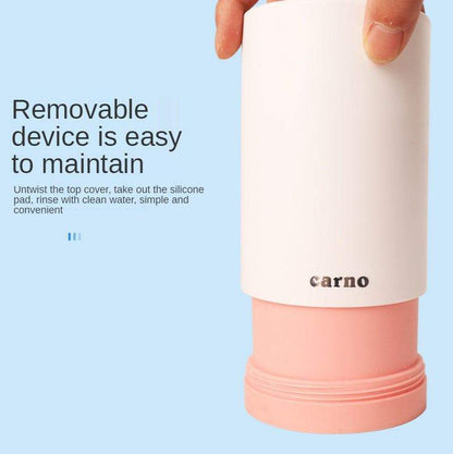Paw Cleaner portable device with removable white cover and pink silicone base for easy cleaning and maintenance