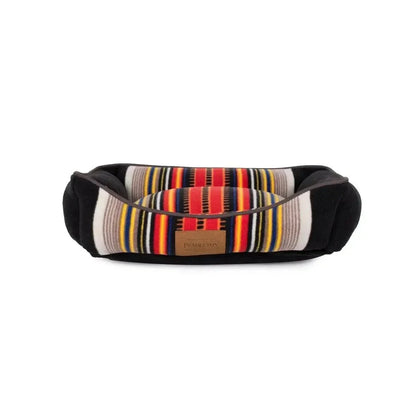 Pendleton National Park Kuddler dog bed with colorful striped design and plush fleece sides