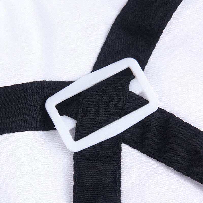 Close-up of Pet Suit with Bow Tie showing black straps crossing with white rectangular buckle on smooth white fabric