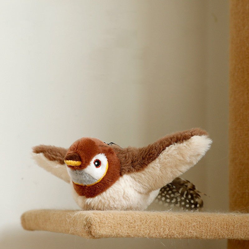 Plush Squeaky Animal Pet Toy shaped like a brown and cream bird, with spread wings, a yellow beak and spotted tail