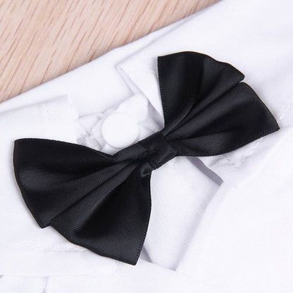 Black bow tie on white pet suit collar for stylish dog outfit