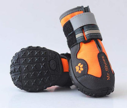 Waterproof boots for medium large dogs with anti-slip sole and reflective straps in orange and black colors