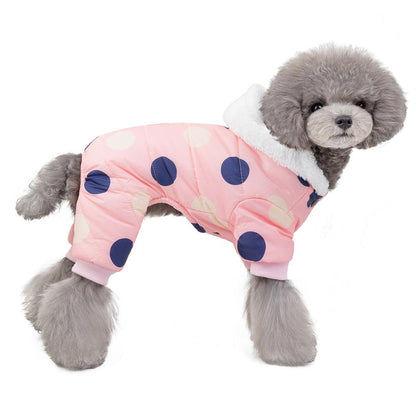 Small dog wearing waterproof pink polka dot snowsuit jumpsuit with fleece lining and hood with ears
