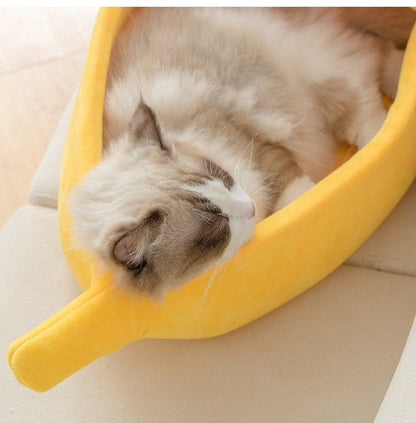 Cozy yellow banana-shaped pet bed with soft plush fabric for cats and small dogs