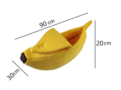 Yellow banana-shaped soft plush pet bed measuring 90x30x20cm for cats and small dogs