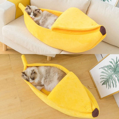 Yellow banana-shaped soft plush pet bed with blanket and cat inside