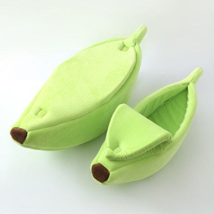 Green banana shaped pet beds for cats and small dogs with soft plush fabric and cushioned interior