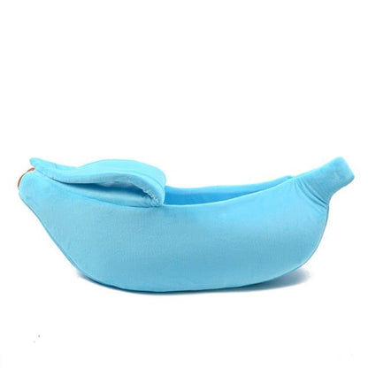 Blue banana-shaped pet bed with soft plush fabric and removable cover for cats and small dogs
