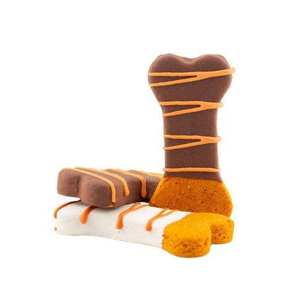 Three Dipped Bones dog treats in autumn colors with peanut butter and yogurt icing