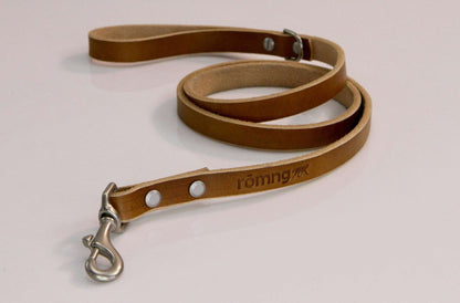 Handmade leather dog leash in camel color with nickel-plated swivel snap and stamped logo