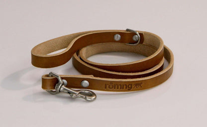 handmade leather dog leash in natural brown with metal clasp and branded logo