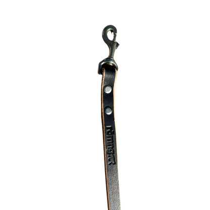 Handmade black leather dog leash with nickel-plated brass clasp and embossed branding