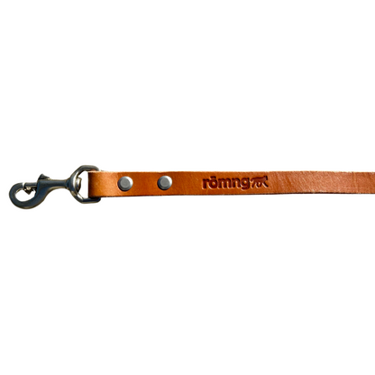 Handmade leather dog leash in camel color with nickel-plated brass swivel clip and beveled edges for comfort