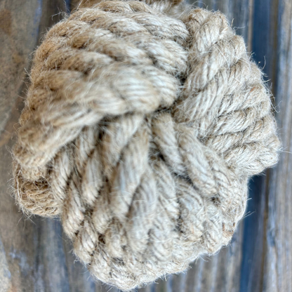 Eco-friendly natural hemp rope dog tug-toy for durable interactive play and dental health.