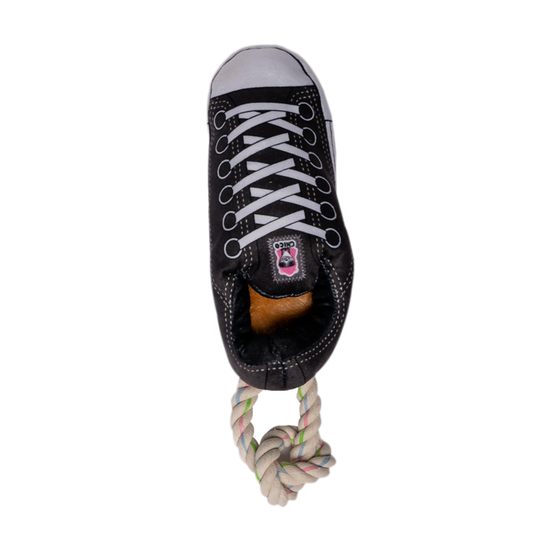 Black squeaky plush sneaker dog toy with treat compartment and tug rope