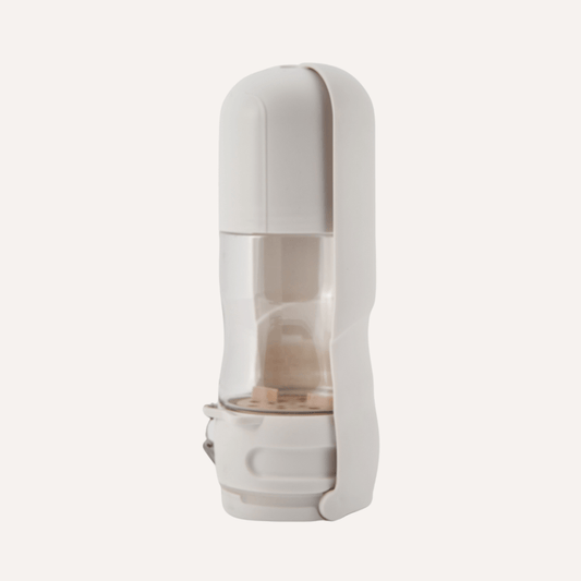 Travel Dog Water Bottle in white BPA-free plastic with transparent water container and compact vertical design