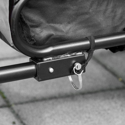Close-up of steel frame lock and key on 2-In-1 Pet Bike Trailer stroller attachment mechanism