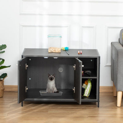 Hidden cat litter box enclosure cabinet with double doors, adjustable shelves, side entry hole, and a cat inside the litter area in a modern living room setting