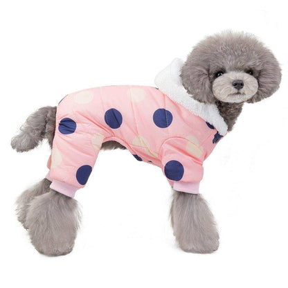 Waterproof Dog Snowsuit in pink with large navy and white polka dots, fleece-lined with a white hood on a small gray poodle.