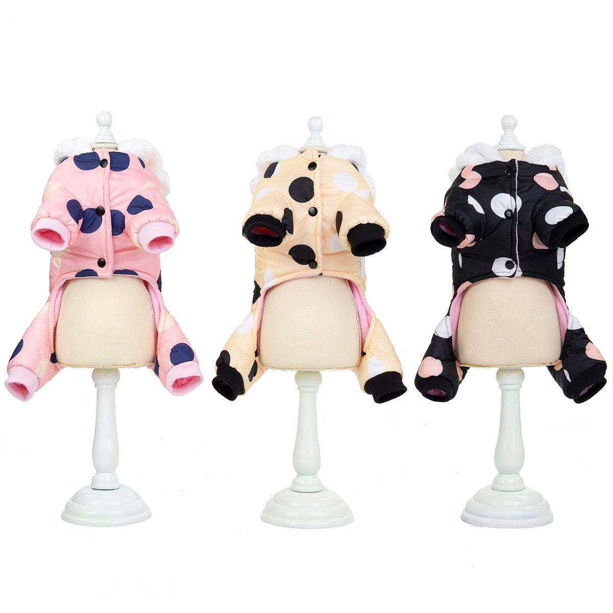 Waterproof Dog Snowsuit in pink, beige, and black with large polka dots, fleece lining, full-body coverage, and cute hoodie ears
